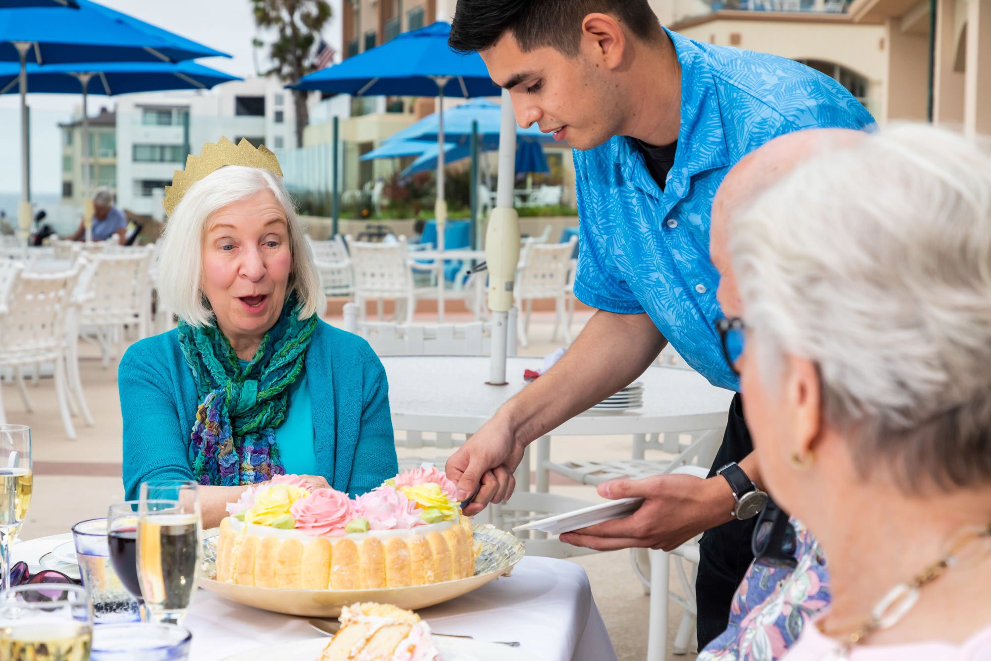 Group of people being served dessert outside